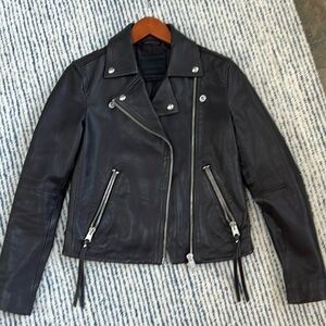 Sleek Black Leather Jacket with Silver Accents
